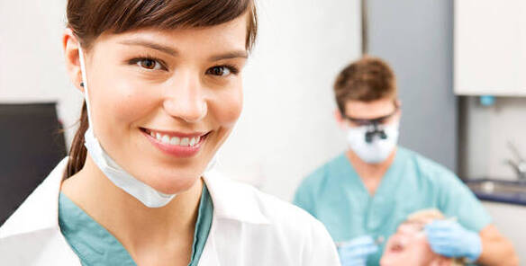 Image of dental assistant at work