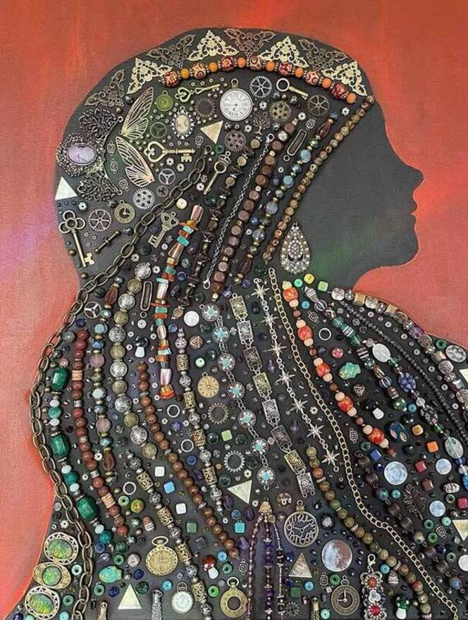 women in silhouette with beaded veil
