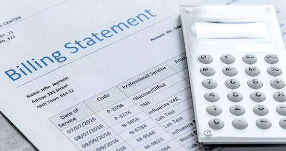 Image of calculator on medical bill