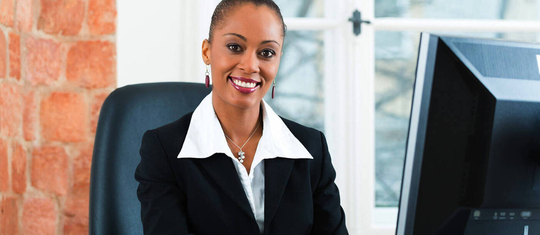 Image of a paralegal working at a computer