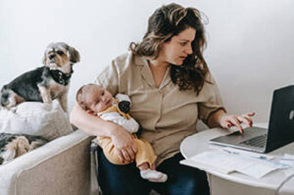 Social Work student studying at home with her child