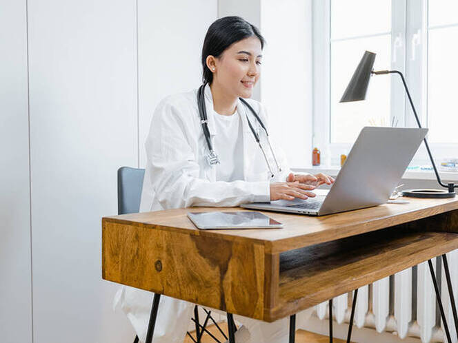 Image of a nurse taking classes at home