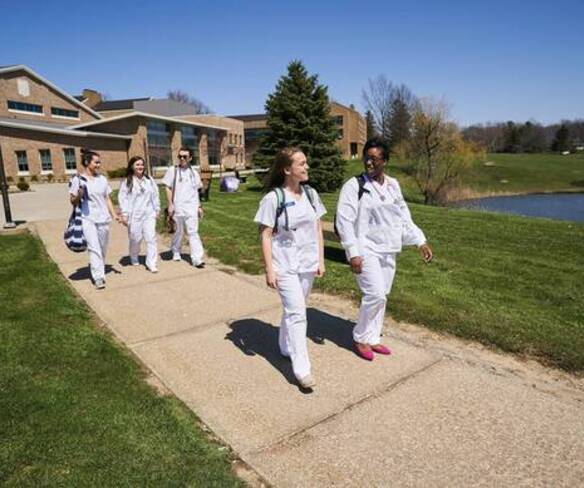Accelerated second degree nursing students walking on campus