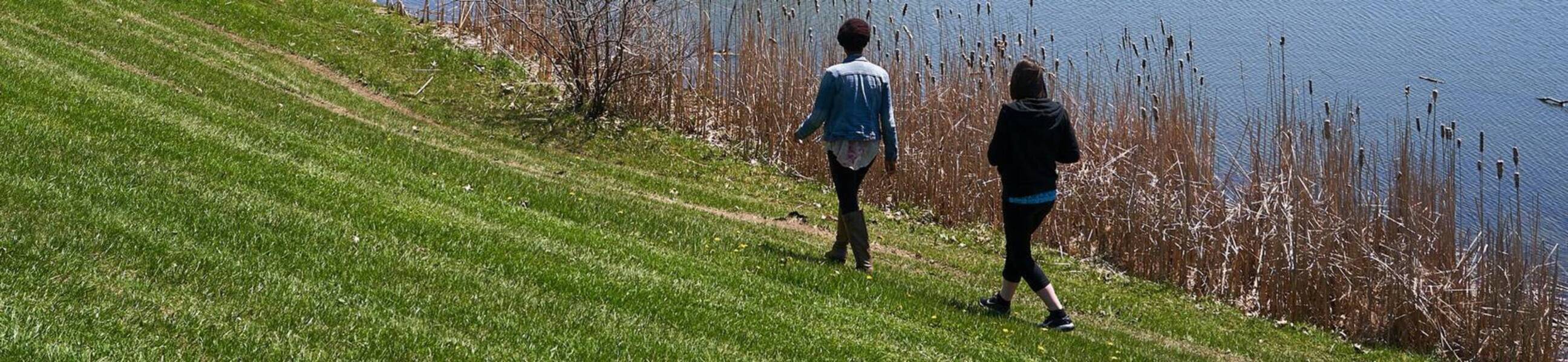 Ursuline college student walk next to pond